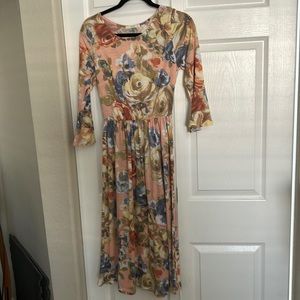 Cute floral midi dress with bell sleeves.